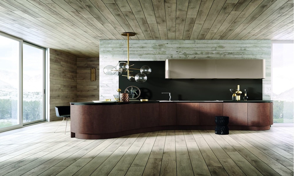 Curved luxury kitchen by Aster Cucine with dark wood cabinetry, integrated appliances, minimalist black backsplash, sculptural island, and modern pendant lighting in a high-end contemporary interior.