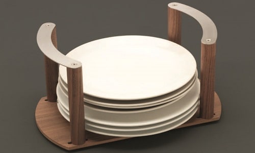 Wooden plate holder with curved handles holding stacked white dinner plates, designed for organized luxury kitchen storage.