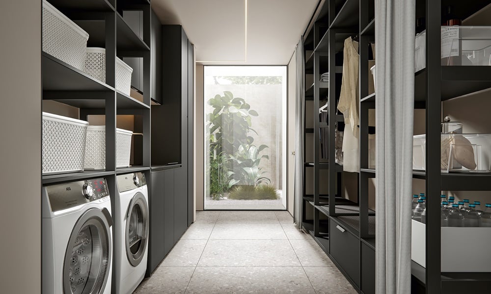 Contemporary walk-through laundry room with built-in washer and dryer, dark open shelving, organized storage baskets, hanging garments, and floor-to-ceiling window bringing in natural light.