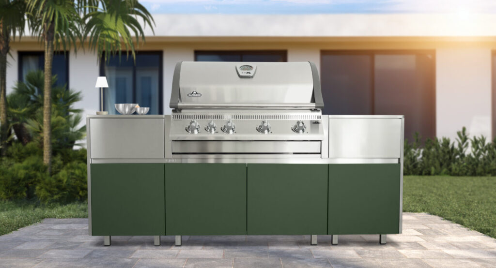 Luxury outdoor kitchen with modern stainless steel grill and weather-resistant cabinetry, featuring green and aluminum finishes for a contemporary backyard design in New York and the Tri-State area.