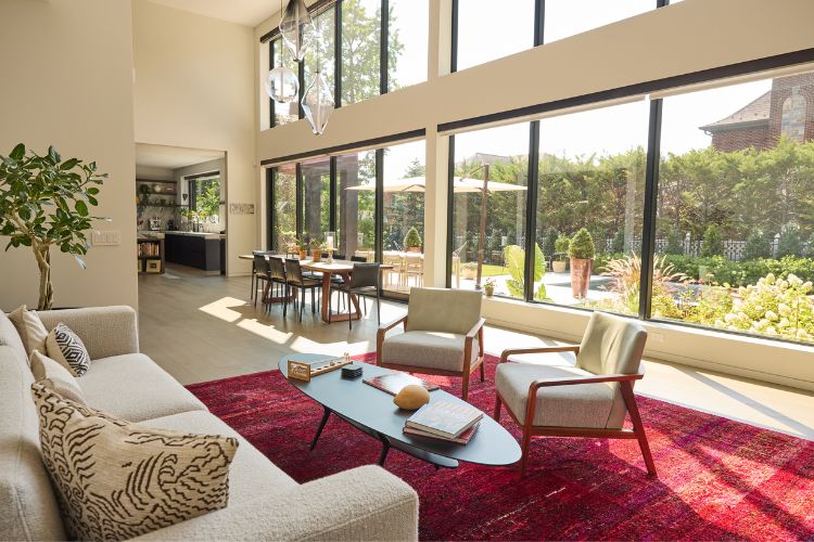Modern farmhouse kitchen with reclaimed wood island, cement-finish cabinetry, quartzite countertops, and integrated appliances, custom designed by Urban Homes.